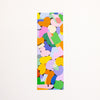 A rectangular bookmark with abstract art print featuring a colourful pattern of overlapping organic shapes in pink, green, yellow, orange, purple, and blue on a white background.