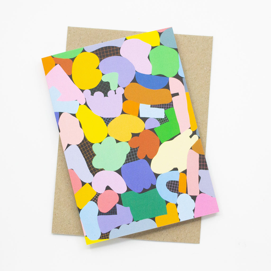 A front picture of the terrain card print. Multicolour abstract shapes on a grid background.