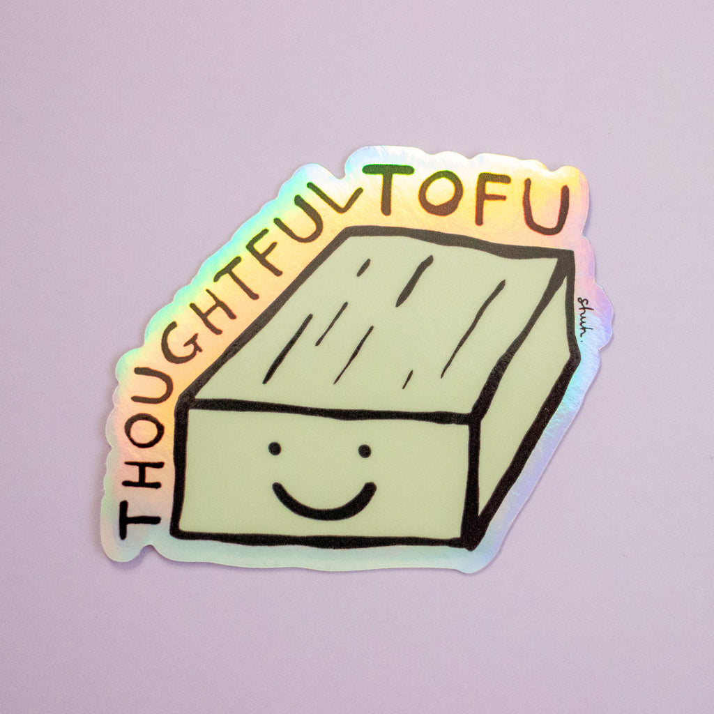 A die-cut sticker featuring a cute, hand-drawn smiling tofu with the words 'THOUGHTFUL TOFU' arched above it, shown on a light lavender background.