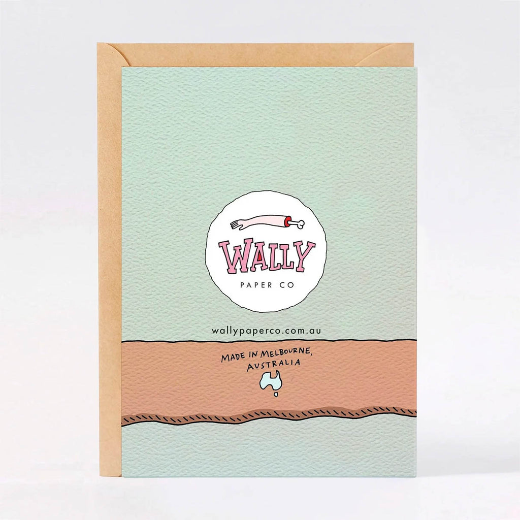 A greeting card with a kraft paper envelope, featuring a textured mint green front with a circular logo for 'Wally Paper Co'.