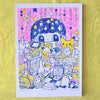 A white art print featuring a colourful hand-drawn illustration of a cute character in a starry room, displayed on a textured yellow background.