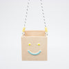Peach rectangular hanging basket with a smiley face design on a white background