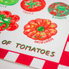 A close-up of a printed sheet featuring colourful tomato illustrations and the text 'OF TOMATOES,' with labels including Truss, Kumato, and Heirloom. The design uses red, green, and white with a playful hand-painted look.