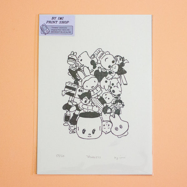 A printed art piece with a black line drawing of a pile of cute cartoon characters, photographed against a peach-coloured background. A purple label in the top-left corner reads 'BY IMI PRINT SHOP'.