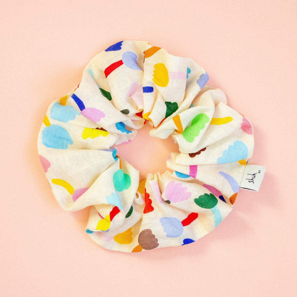 Colourful floral scrunchie on a peach background