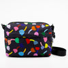 Front view of the Tulip Everyday bag. Print has multicoloured tulips on a black background.