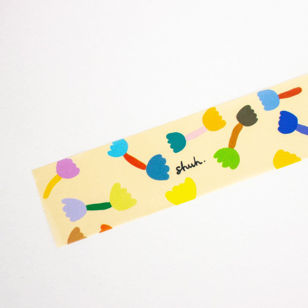 Colorful abstract design on a beige background with 'shuh' branding.