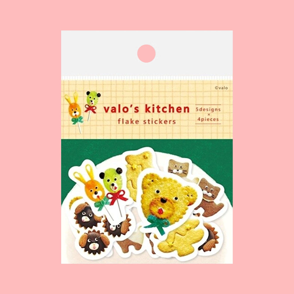 Stickers featuring whimsical shapes and patterns, each decorated with colourful sweet foods like cookies and chocolate, arranged on a solid pink background.