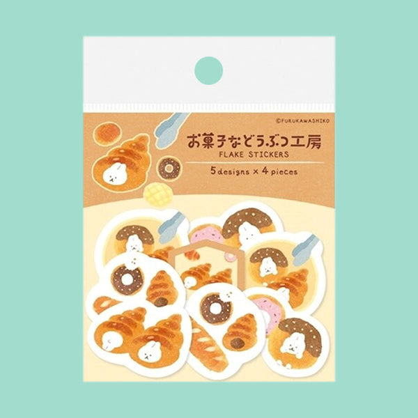 A package of Japanese-style donut stickers featuring cute white cartoon characters on golden-brown donut illustrations, shown on a light teal background.