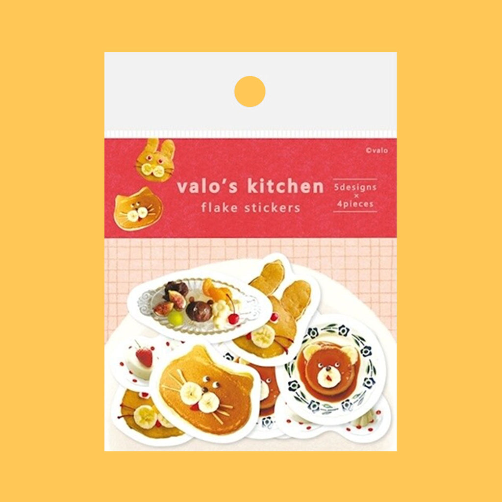 Stickers featuring whimsical shapes and patterns, each decorated with colourful sweet foods like pancake, arranged on a solid mustard background.