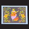 A colourful art print featuring a stylised green cat playing an orange guitar on a dark grey background, framed by yellow and pink flowers with green vines. The print has a white border and is photographed against a solid black background.