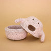 Handbuilt ceramic figurine by shuh. with a speckled pink glaze, round body, small arms, and an open mouth expression. Character is actually a storage canister, and this picture shows bottom and top halves open. 