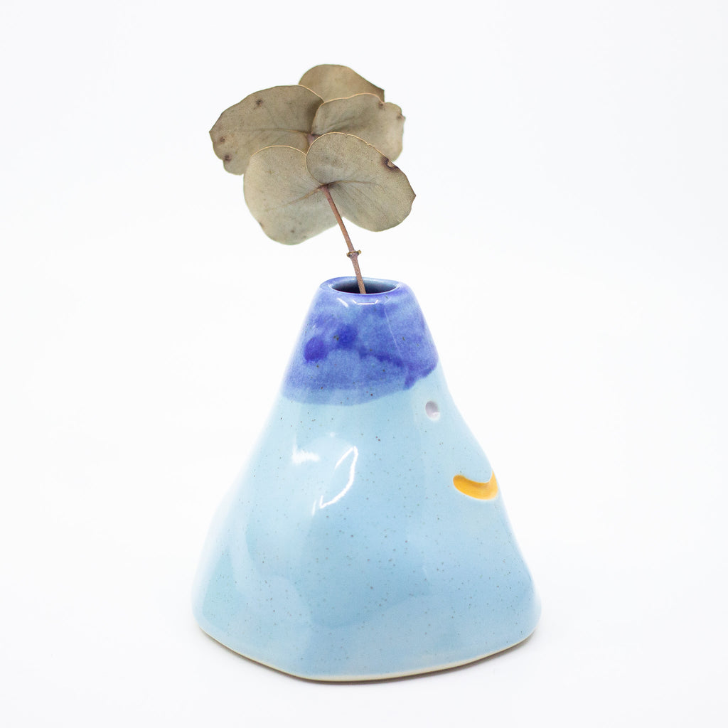 Side view of Wobbly vase number 1 with leaf. Blue colours. 