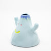 Ceramic vase shaped like a cartoon ghost with colorful accents on a white background