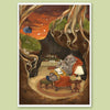 A framed art print featuring a whimsical illustration of a wombat sitting in an armchair inside a tree hollow, with a small house under a tree and an orange sky in the background, displayed on a light green background.