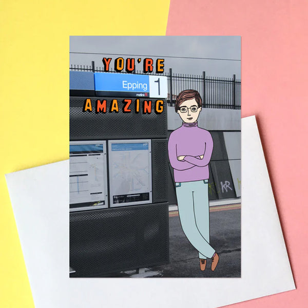 Greeting card with a person standing in front of a sign and text 'YOU'RE Epping 1 AMAZING' on a colouful background.