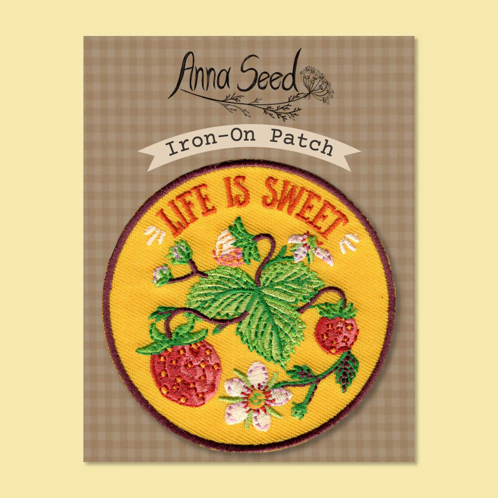 Iron-on patch with 'Life is Sweet' text and strawberry design on a checkered background