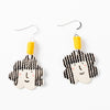 Two drop earrings with short hooks, and yellow fabric accents. Ceramic beads with girls face, a smile, pink cheeks, and curly hair. 
