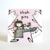 Enamel pin depicting a hand-drawn illustration of a person with a cat walking over their arm, displayed on a pink backing card with cat illustrations and "shuh. pins" branding.