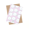 Back view of the cool as a cucumber print. Repeated cucumber slices over a pink background. 