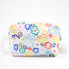 Front view of the Daisy everyday bag. Multicoloured daisy illustrations on a white background. 
