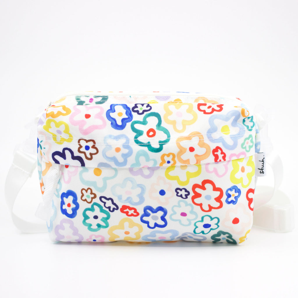 Front view of the Daisy everyday bag. Multicoloured daisy illustrations on a white background. 