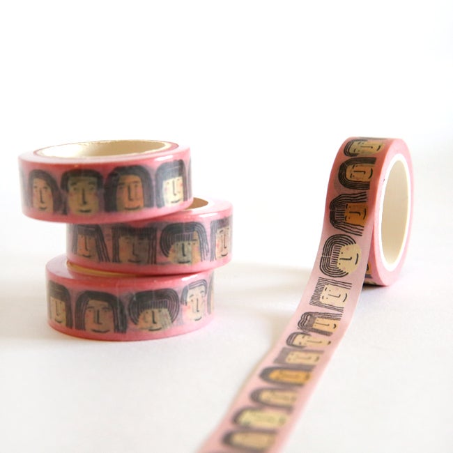 3 rolls of the Fab Faces washi tape. Rows of diverse faces on a pink background. 
