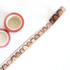 3 rolls of the Fab Faces washi tape. Showing a row of diverse faces on a pink background. 