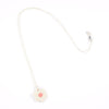 Sterling silver necklace featuring a hand-painted white ceramic flower-shaped pendant, displayed on a white background.
