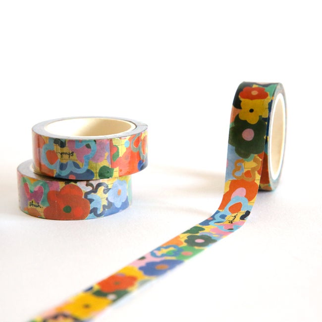 Multicoloured flowers on a roll of Washi tape. 