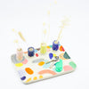 In use and top view of the Grande trinket dish. Multicolour abstract paint. 4 spouts to hold rings, and put flowers in. 