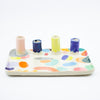 Front view of the Grande trinket dish. Multicolour abstract paint. 4 spouts to hold rings, and put flowers in. 