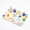Rotated top view of the Grande trinket dish. Multicolour abstract paint. 4 spouts to hold rings, and put flowers in. 