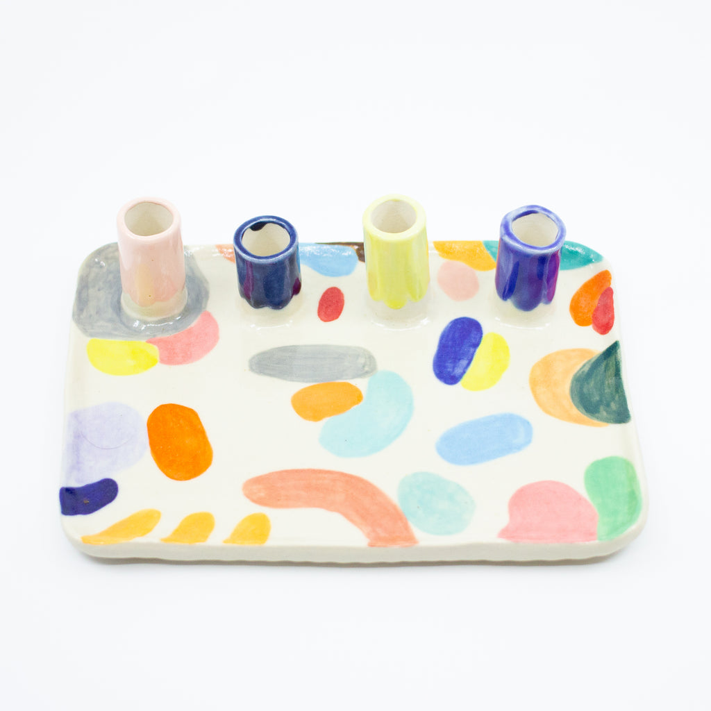 Top view of the Grande trinket dish. Multicolour abstract paint. 4 spouts to hold rings, and put flowers in. 