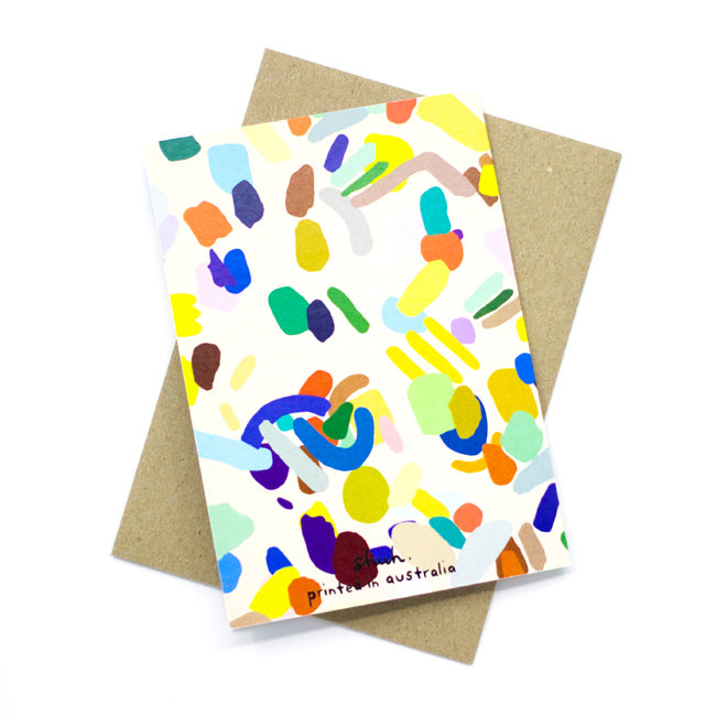 A back view of the Hanging Out card print. Abstract shapes in multicolours on a cream background.