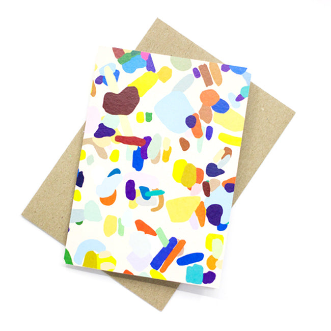 A front view of the Hanging Out card print. Abstract shapes in multicolours on a cream background.