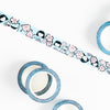 5 rolls of the Happy Luci Washi Tape. 1 unrolled. Showing the Happy Luci character, the shuh. girl, and a monster vase. 