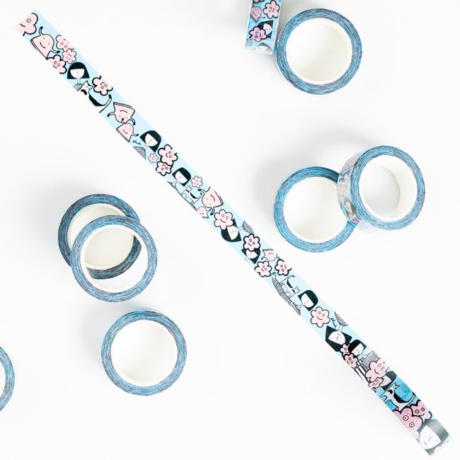 8 rolls of the Happy Luci Washi Tape. 1 unrolled. Showing the Happy Luci character, the shuh. girl, and a monster vase. 