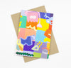 Front view of the Joy Mat print card. Abstract shapes, characters, and bright colours over a background of multicoloured sqaures. 