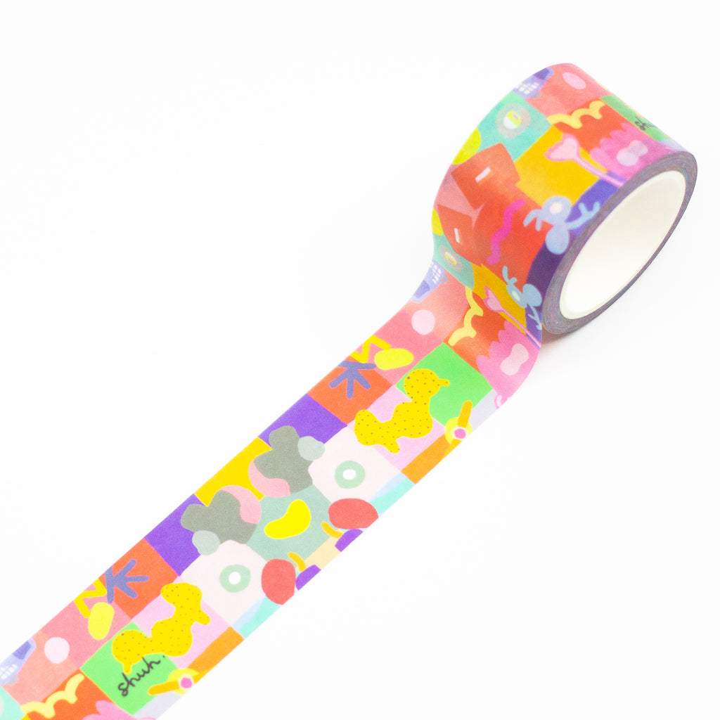 1 roll of Joy Mat washi tape. Featuring a mulitcoloured print with squigles, lines, and patterns on a grid background. 
