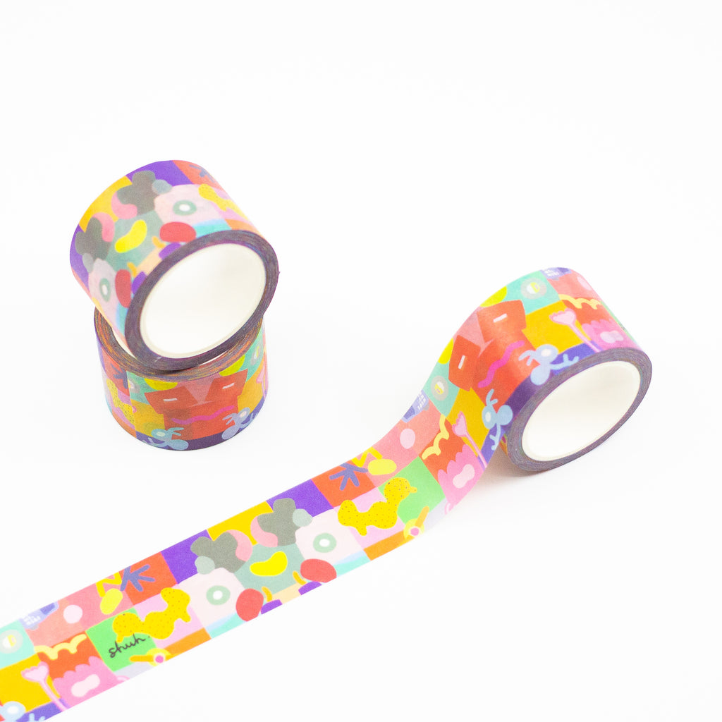 3 rolls of Joy Mat washi tape. Featuring a mulitcoloured print with squigles, lines, and patterns on a grid background. 