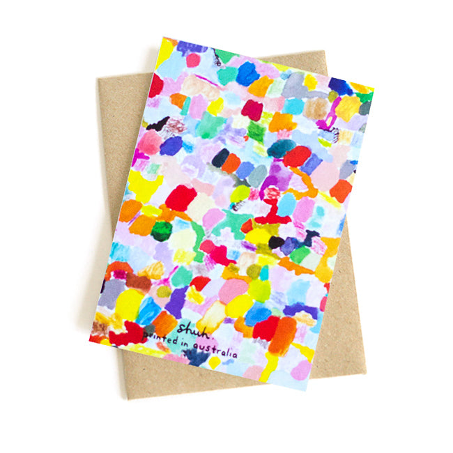 A picture of the landscape gift card and recycled paper envelope. Bright abstract colours representing a landscape