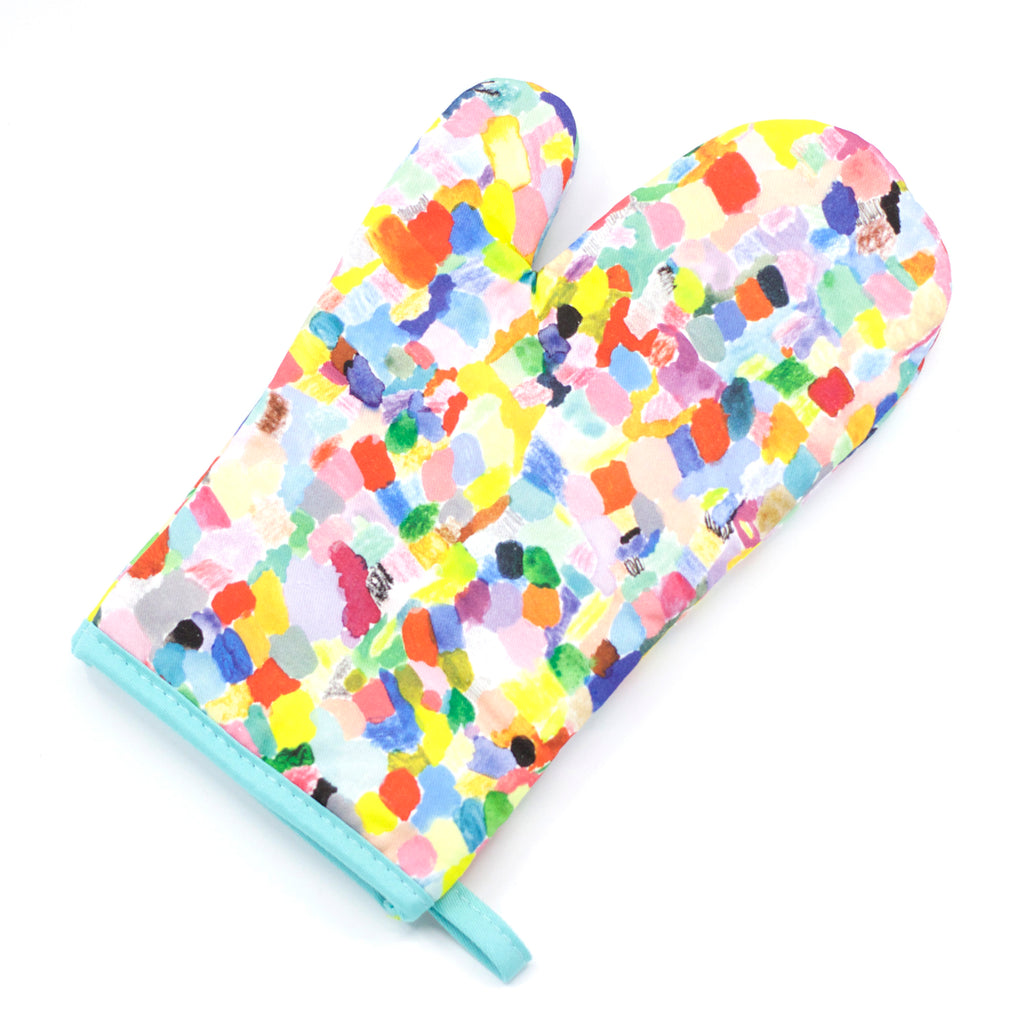 A top view of the Landscape oven mitt. An impressionist representation of a mountain view. Multi coloured and abstract. 
