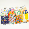A Top view of the shuh lavender sachet collection. Featuring 8 different prints. Each print has the name of the print above or below. 