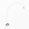Sterling silver necklace with a small, round hand-painted ceramic pendant featuring a playful girl’s face illustration, displayed on a white background.