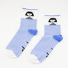 Side by side view of the shuh. girl socks. Featuring the iconic shuh. girl and a blue and white striped pattern, these socks are designed to bring fun and imagination to your feet