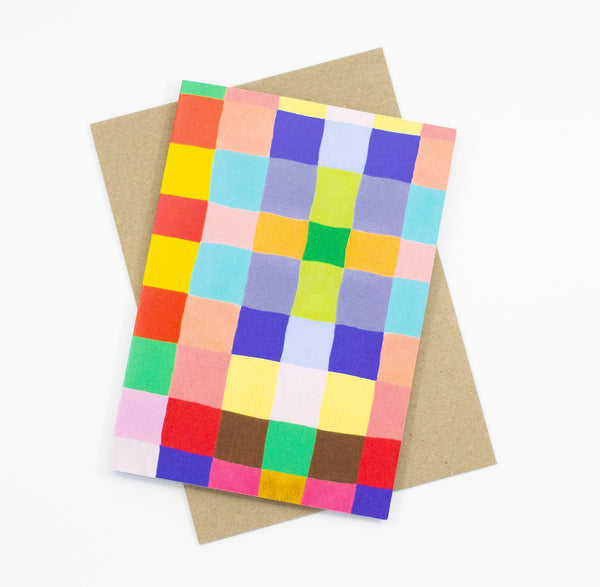 Front view of the squares print card. Multicolour squares forming a chequered pattern. 