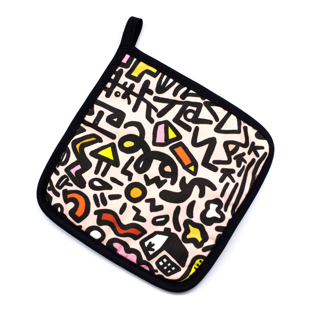Top view of the sweet pot holder. Street inspired design, pink, black, and yellow designs on a pink background. 