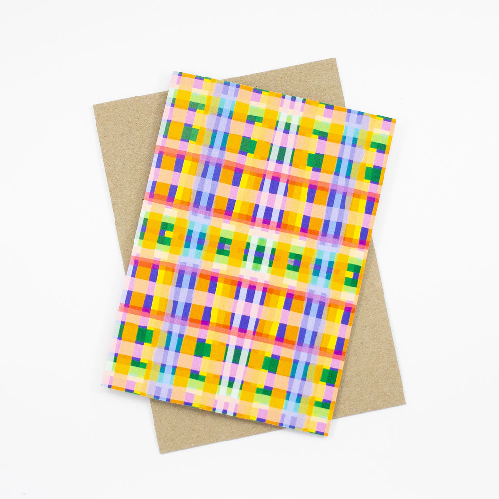 Front view of the Tartan print card. Multicoloured checkered print, orange, purple, green, yellow, blue, lavender, and pink. 