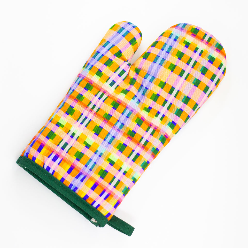 A top view of the Tartan oven mitt. Green, pink, orange, yellow, blue, purple tartan pattern. 